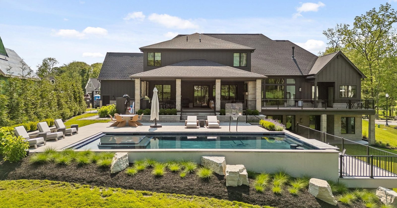 Landscaped backyard with lawn, planting and outdoor living area